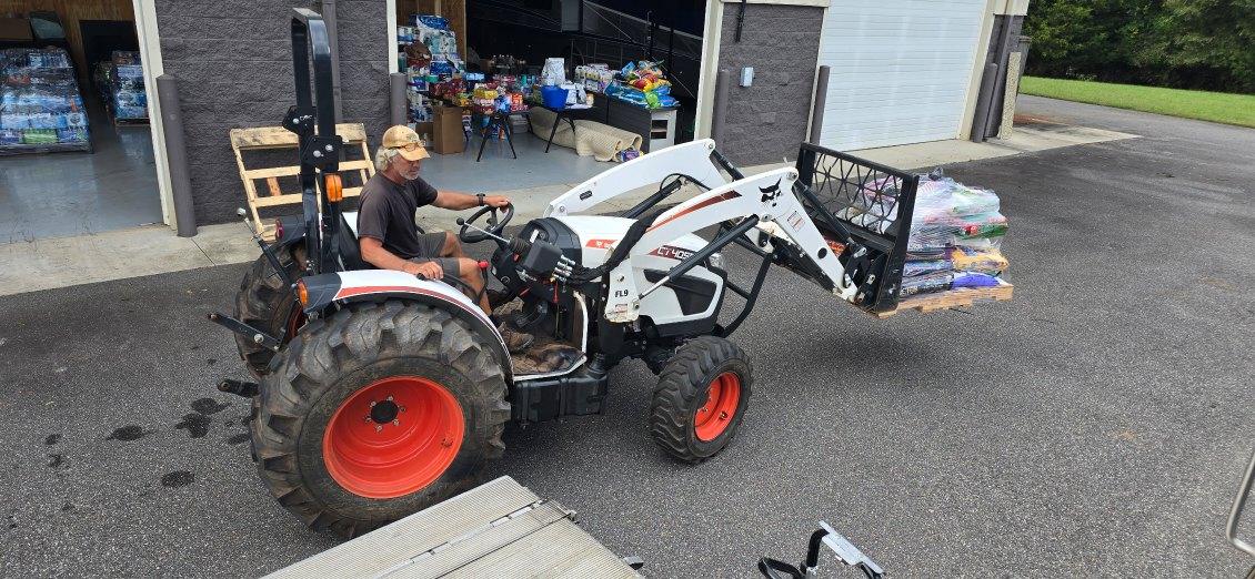 Volunteer driving tractor