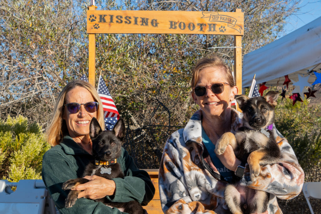 Volunteers with puppies