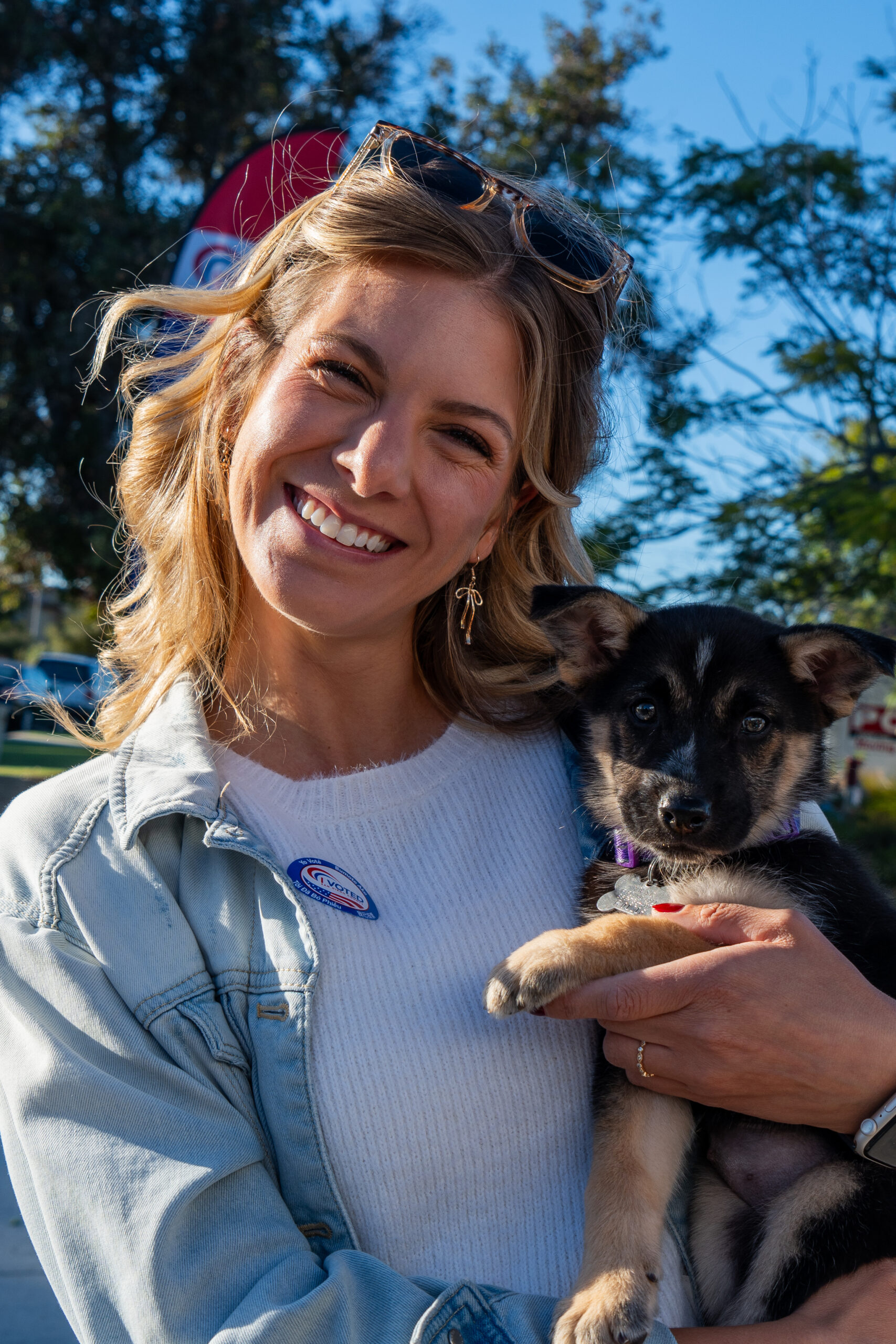 Lady with puppy at polls