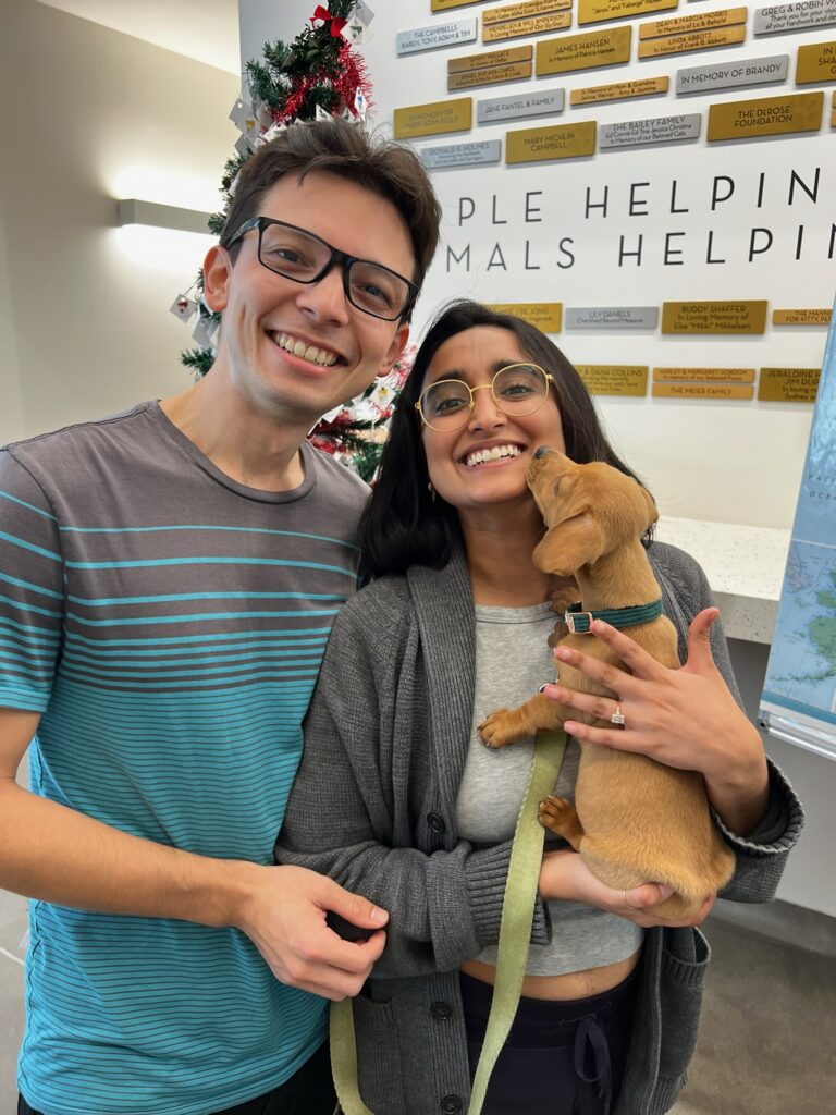 Photo of couple holding puppy