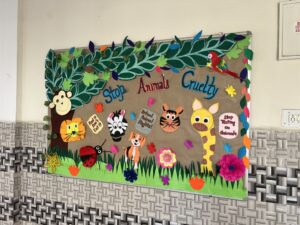 A sign reading "Stop Animal Cruelty" with bright florescent decoration