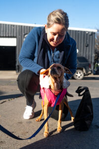 Eva with pink jacket dog