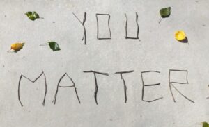 The words 'You Matter' written with sticks