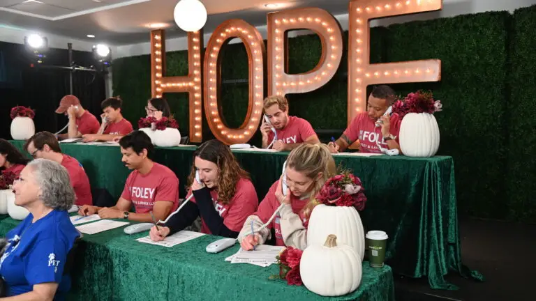 Volunteers answering phones at a 2 tiered phone bank for the HWAC HOPE Telethon